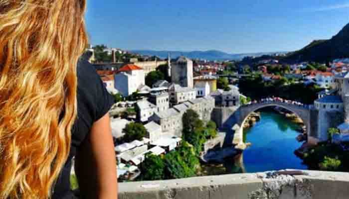 Cassandra having view-of-bridge-in-bosnia